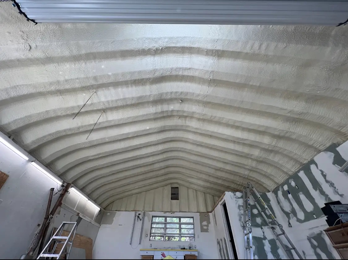 Spray polyurethane foam applied to the underside of a metal roof deck in Three Rivers